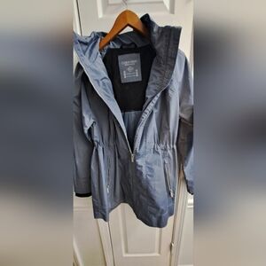 Amazing Calvin Klein raincoat. With a hoody for rainy days or snowy days.